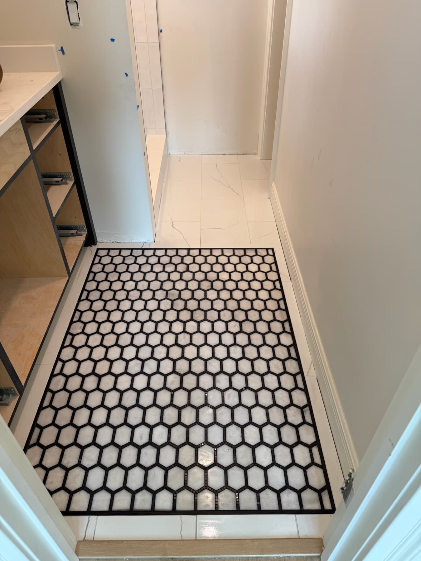 Black and white hexagon mosaic tile floor in Pensacola, FL