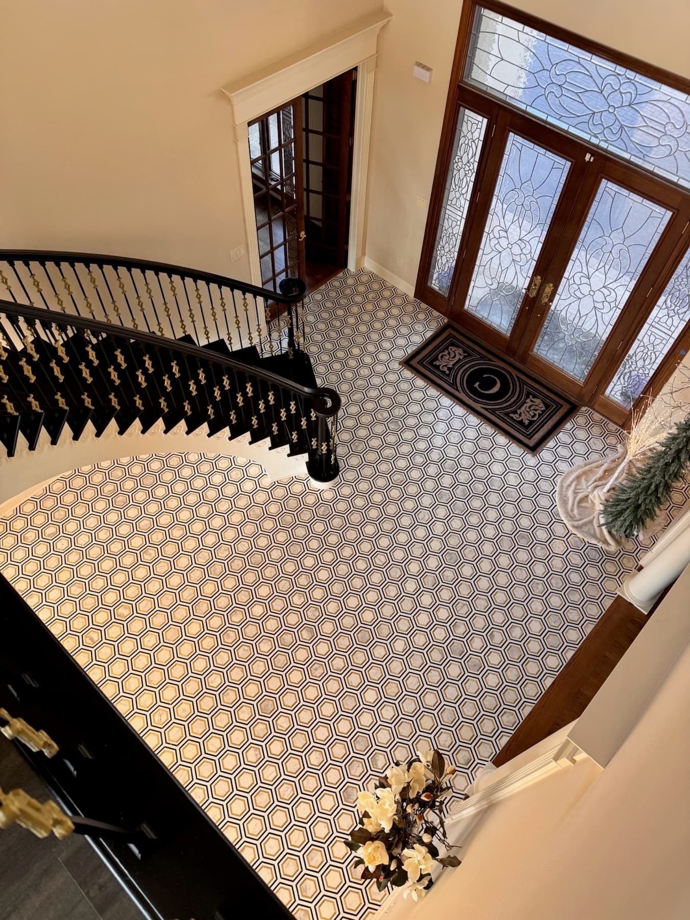 Patterned tile entry floor seen from a spiral staircase in Pensacola, FL